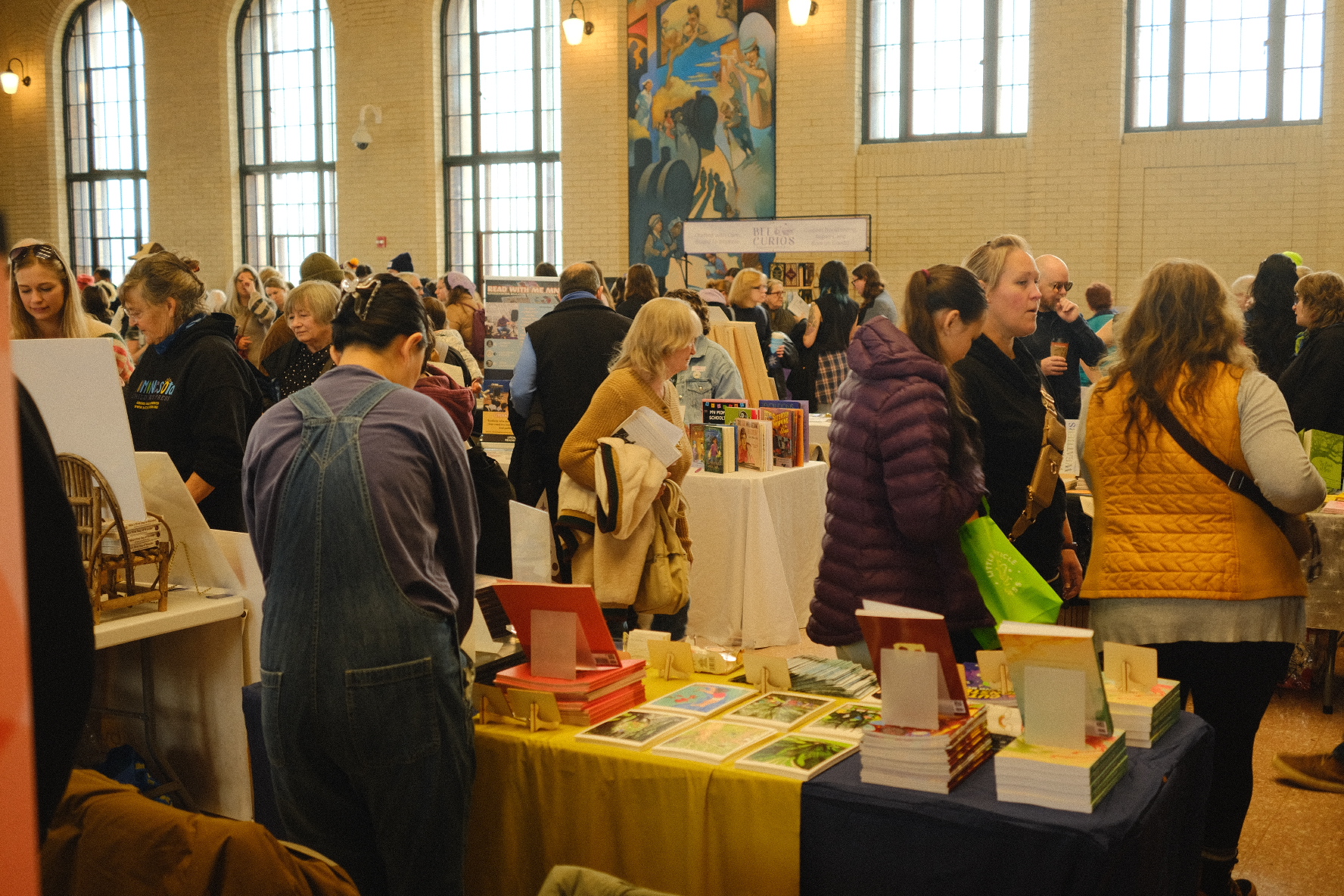 The festival floor at Union Depot, Saint Paul, full of visitors and tables